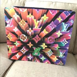 Louis Vuitton shopping bag.